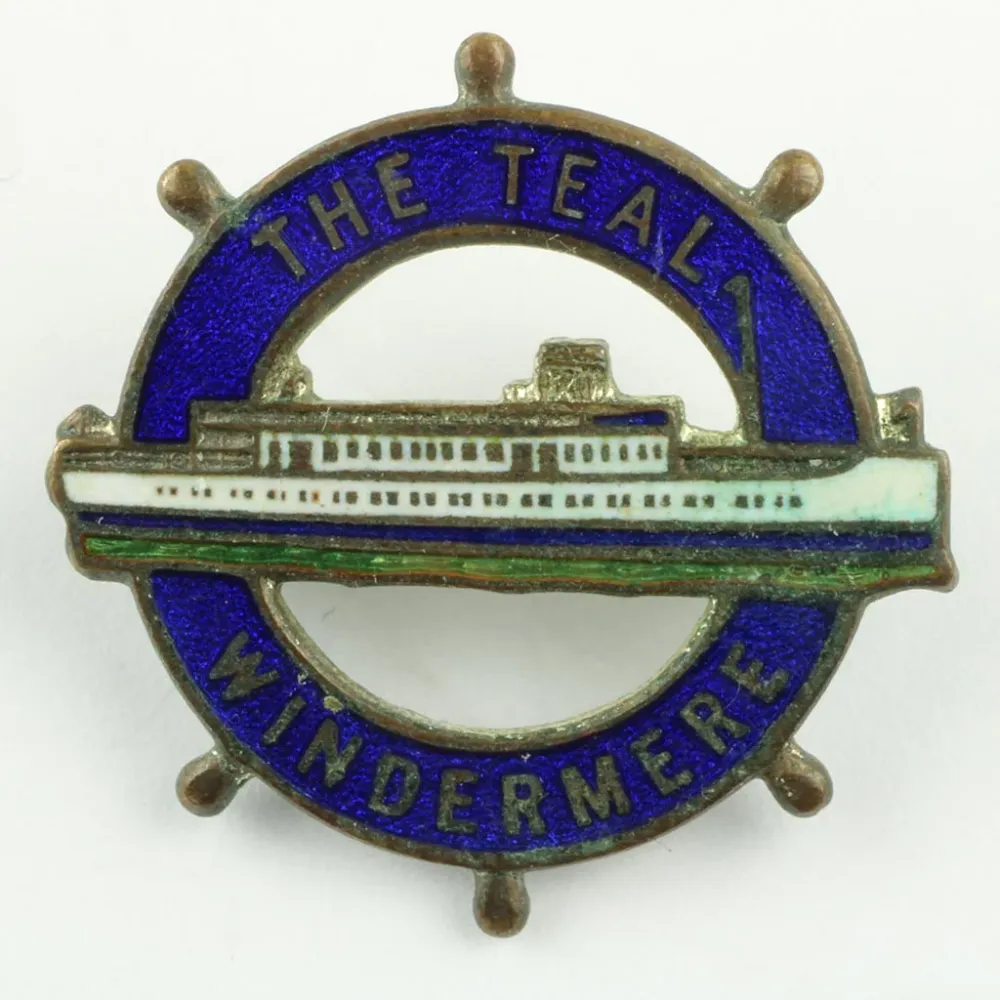 Emblem fra Påfugl Windemere